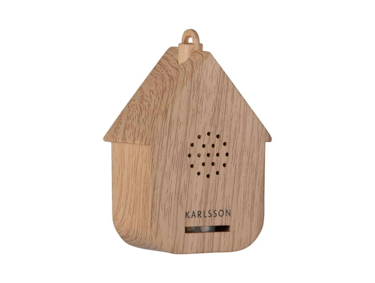 Zijaanzicht van de strakke minimalistische Karlsson mini cuckoo sound box met lichte houtlook print.
