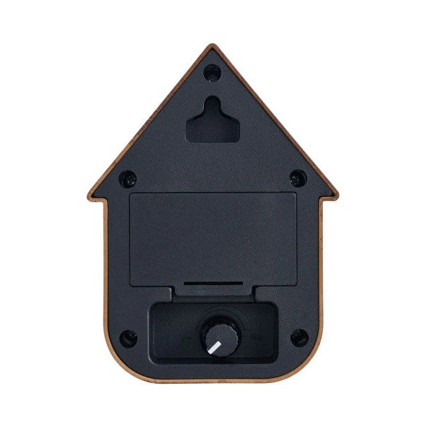Achterzijde van de Karlsson Modern Cuckoo Dark Wood soundbox met het batterijvak en de volumeknop.